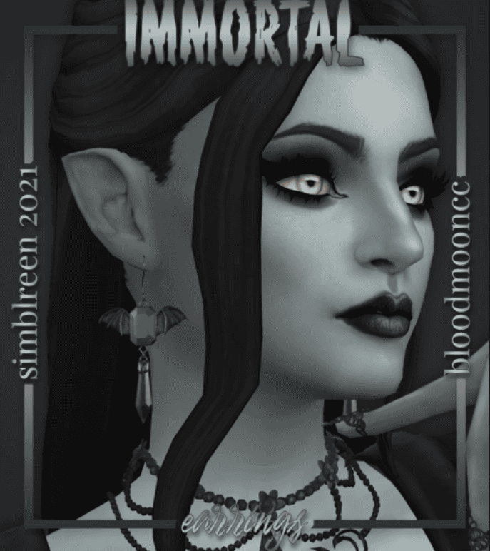 Vampire sim wearing black dangle sims 4 goth cc earrings with a green gem in the middle and bat ears on the sides